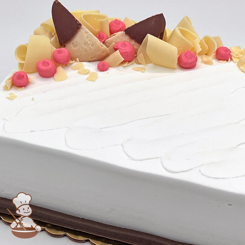 Sheet cake with white chocolate curls and chocolate dipped shortbread cookies with buttercream dollops.