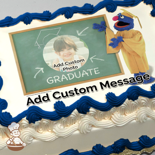 Illustration of Grover from Sesame Street in a graduation cap and gown, next to a placeholder for a custom photo, printed on a sheet cake.