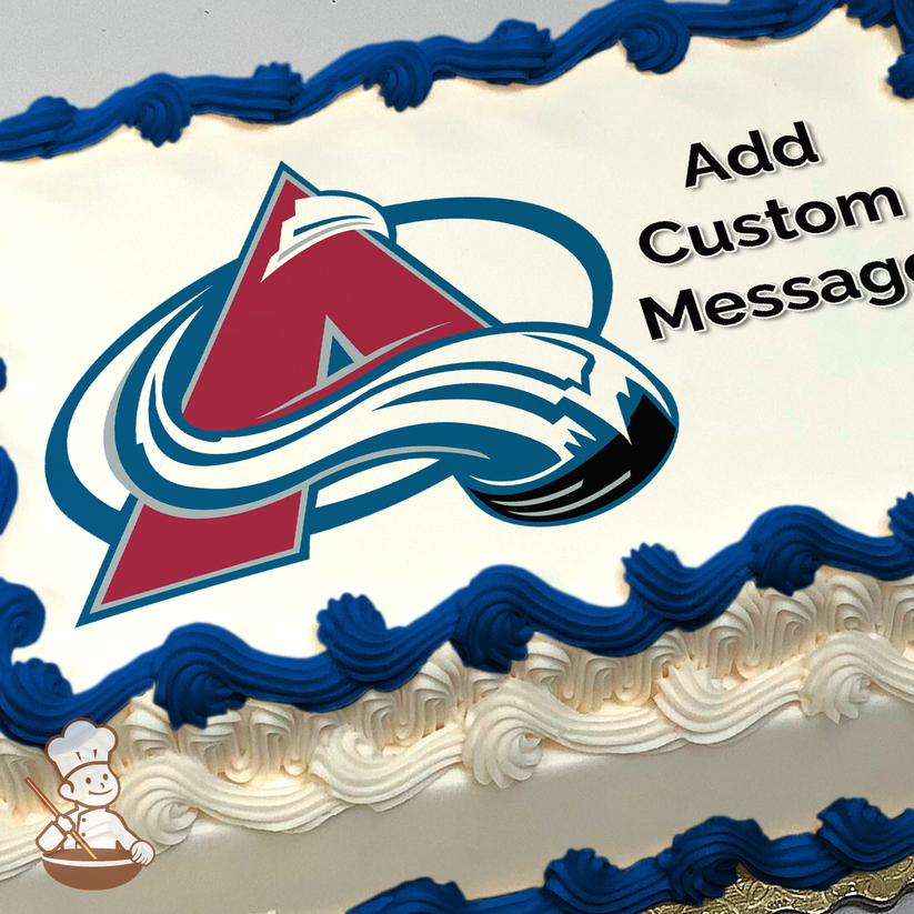 Sports team logo with a letter "A" and swirling snow design, printed on a sheet cake.
