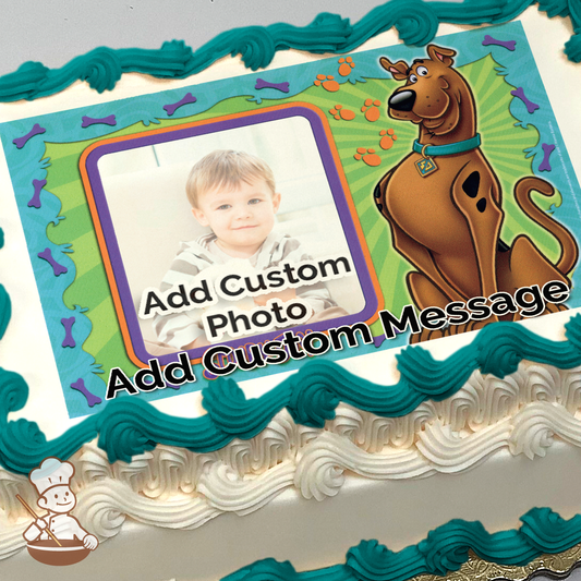 Illustration of Scooby-Doo next to a placeholder for a photo, surrounded by a frame with paw prints and bones, printed on a sheet cake.