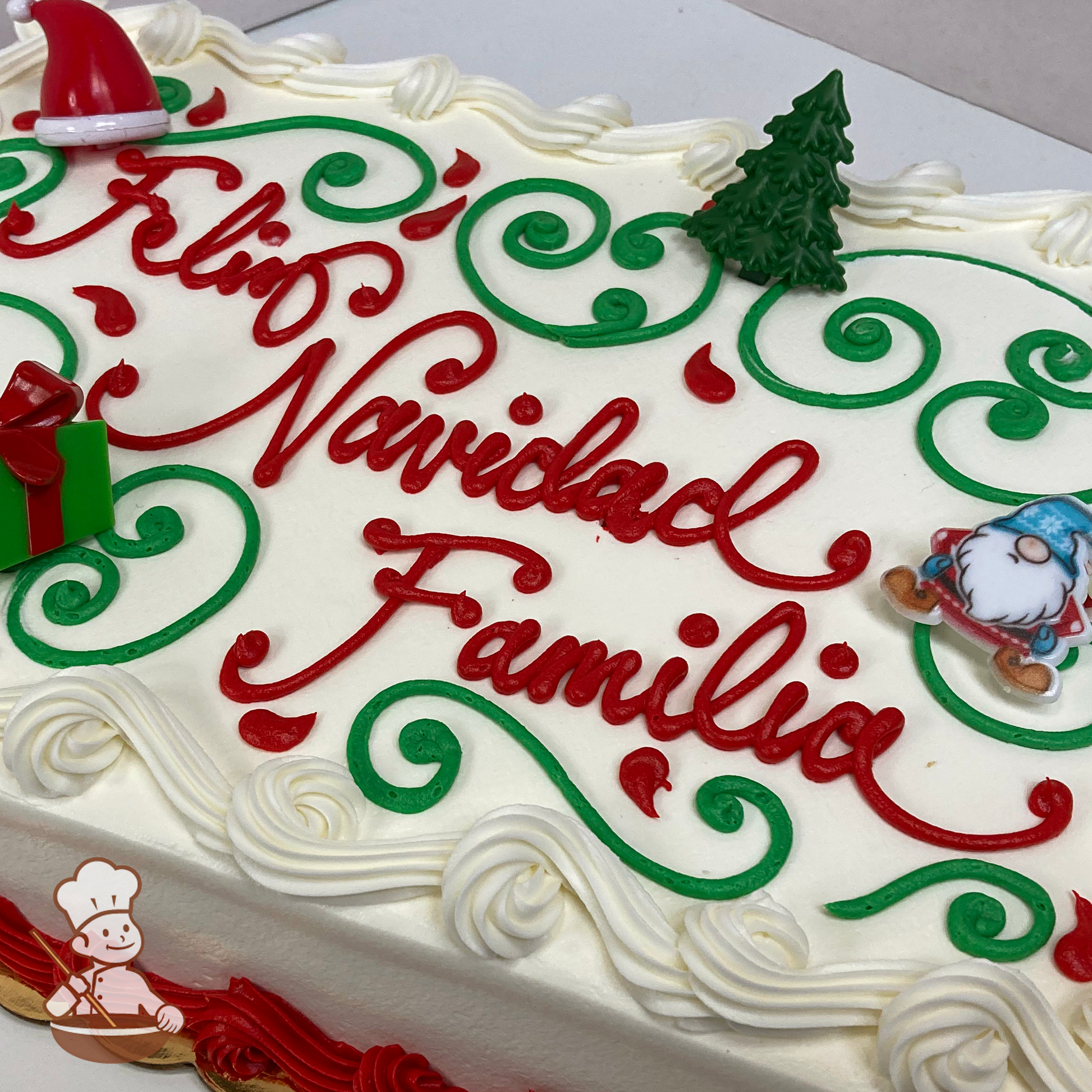 Christmas sheet cake with modern scrolls with Christmas gnome, tree, santa hat and gift box ring toys.