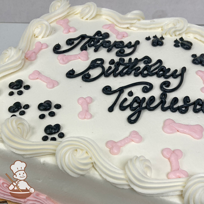 Themed white sheet cake with black animal doggie paws and pink bones.