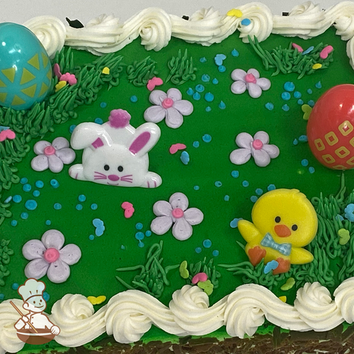 Easter sheet cake with spring bunnies, chick, eggs, and daisies on green lawn.