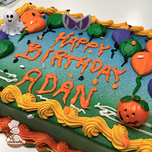 Birthday sheet cake with buttercream balloons in a spooky night with toy rings including ghost, pumpkin and animal eyes.