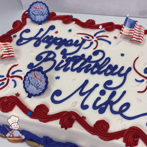 Patriotic sheet cake with sprinkles and buttercream fireworks, Shake your Sparkle toy rings and American flag toothpicks. 