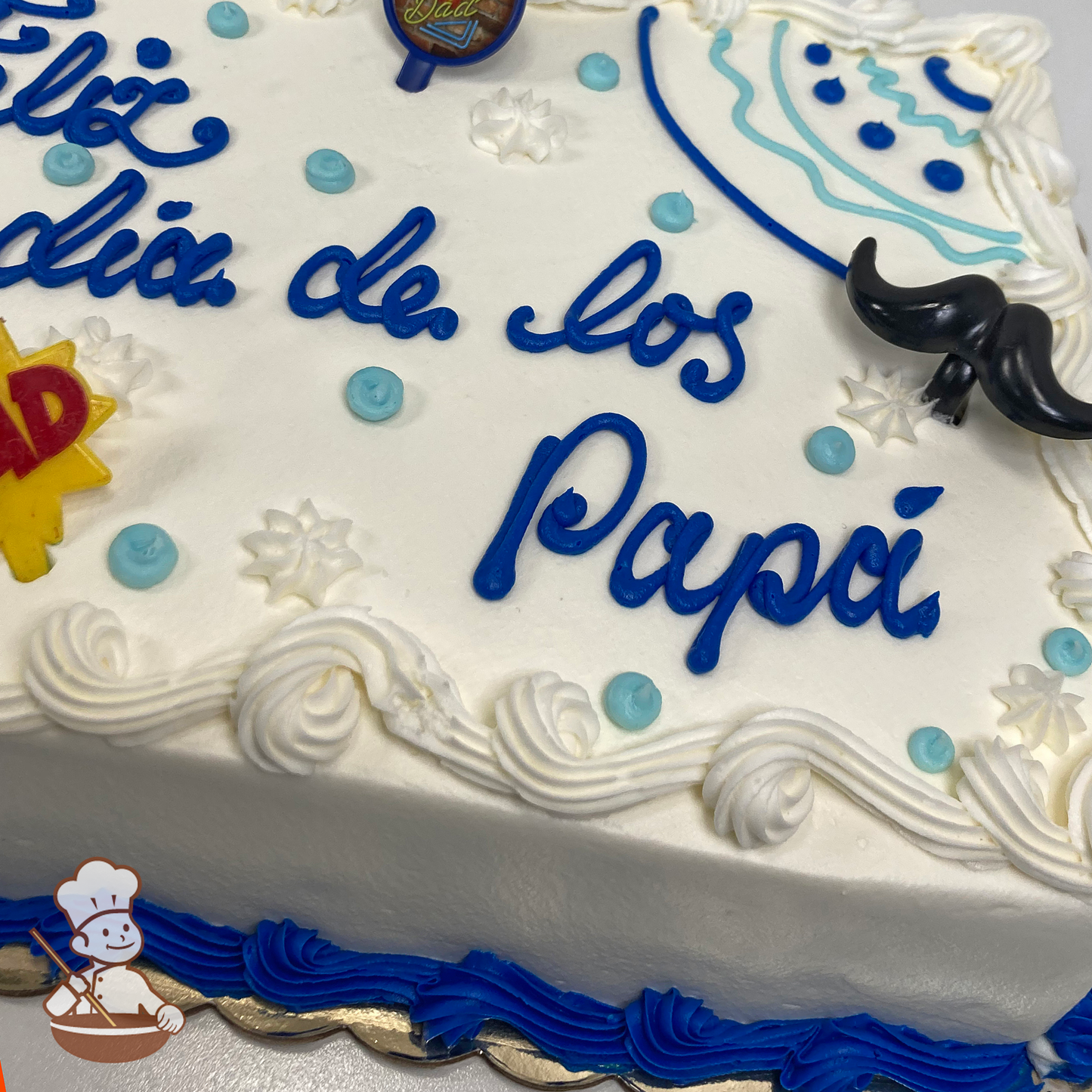 Father's Day sheet cake with buttercream piping in tribal patterns, dots and star tips with moustache and Dad toy rings.