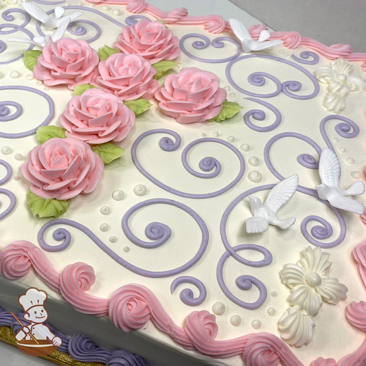 Baptism sheet cake with buttercream daisy flower and roses in form of a cross with toy doves.