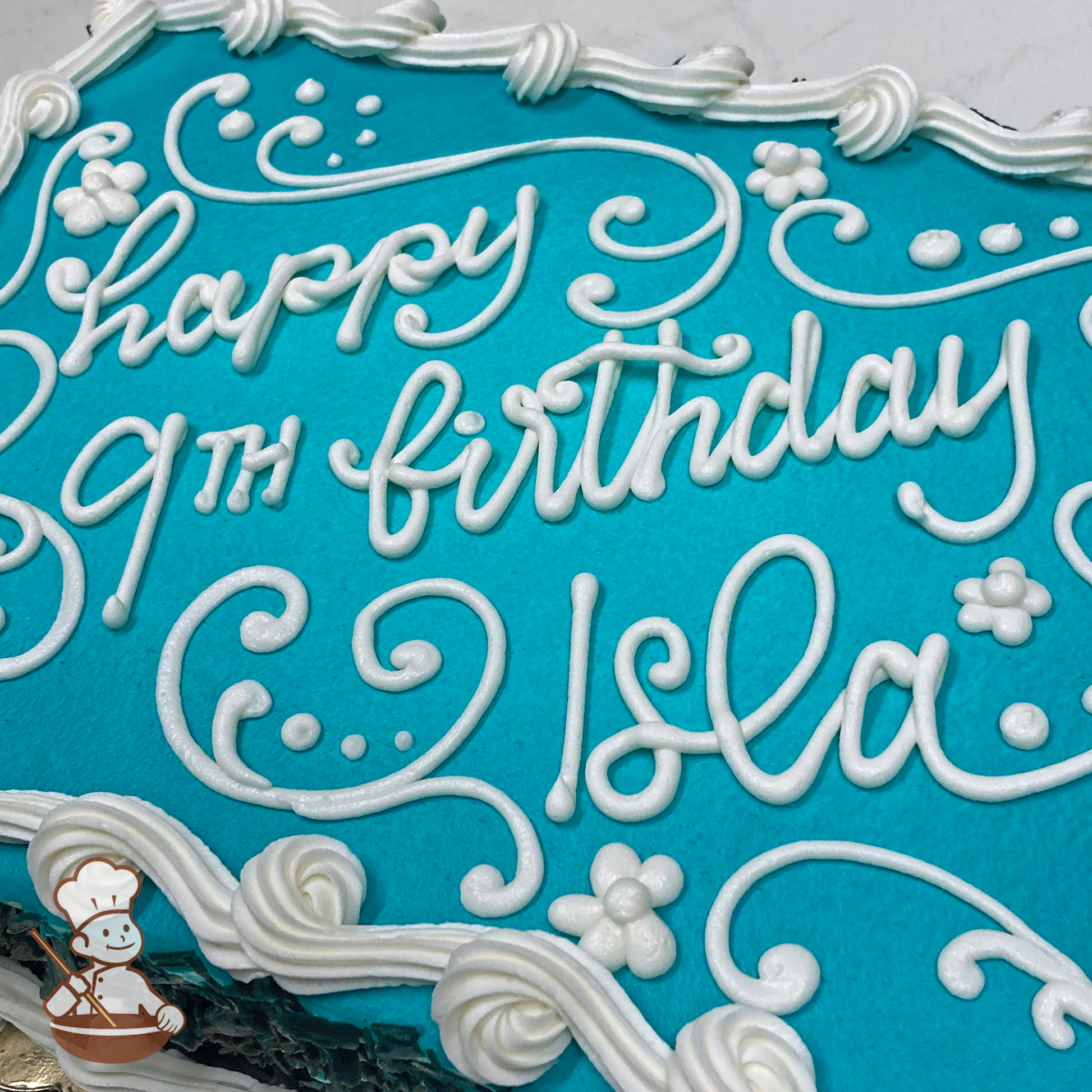 Birthday sheet cake with tiffany blue background and buttercream scroll and daisy flowers.