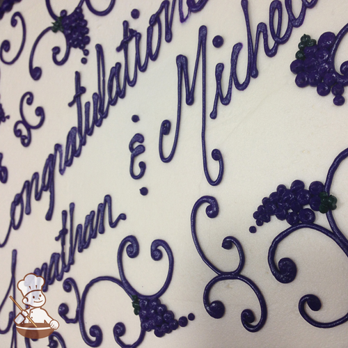 Engagement sheet cake with buttercream scrolls and grape pattern clusters.