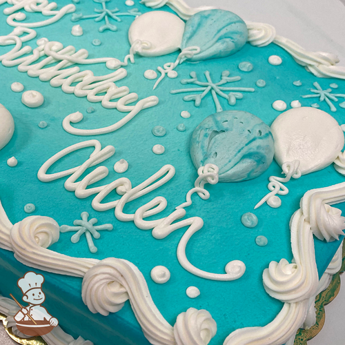 Birthday sheet cake with tiffany blue background and buttercream balloons and snowflakes.