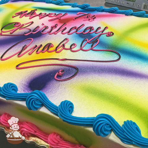 Birthday sheet cake with colorful colors sprayed on in streaks.