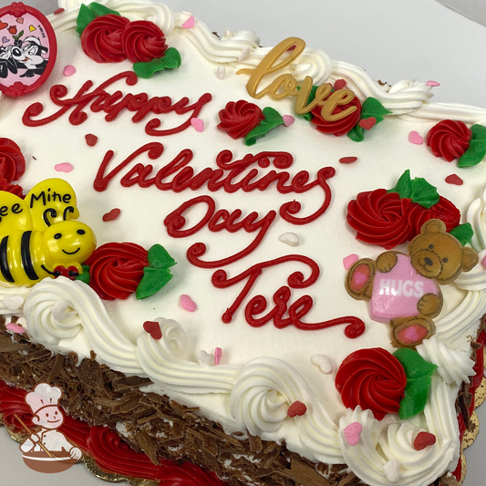 Valentine's sheet cake with buttercream rose swirls, sprinkles, Bee Mine, Heart Hugs Bear, Love and Pee Pee le Pew shunks.