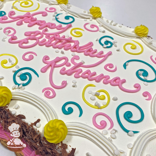 Birthday sheet cake with buttercream swirls and piped drape with sprinkles.