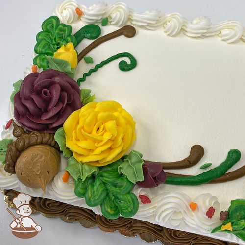 Autumn sheet cake with buttercream flowers and acron branches and sprinkles.