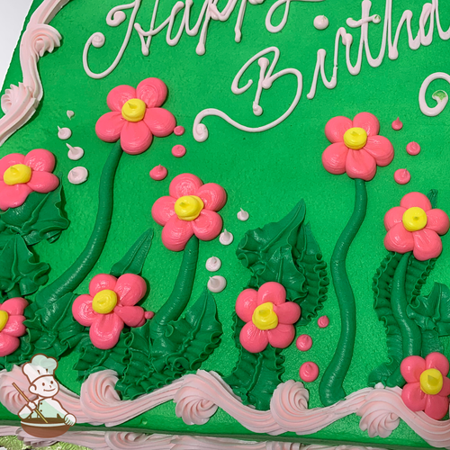 Birthday sheet cake with buttercream daisy flowers on grass stems and bubbles.