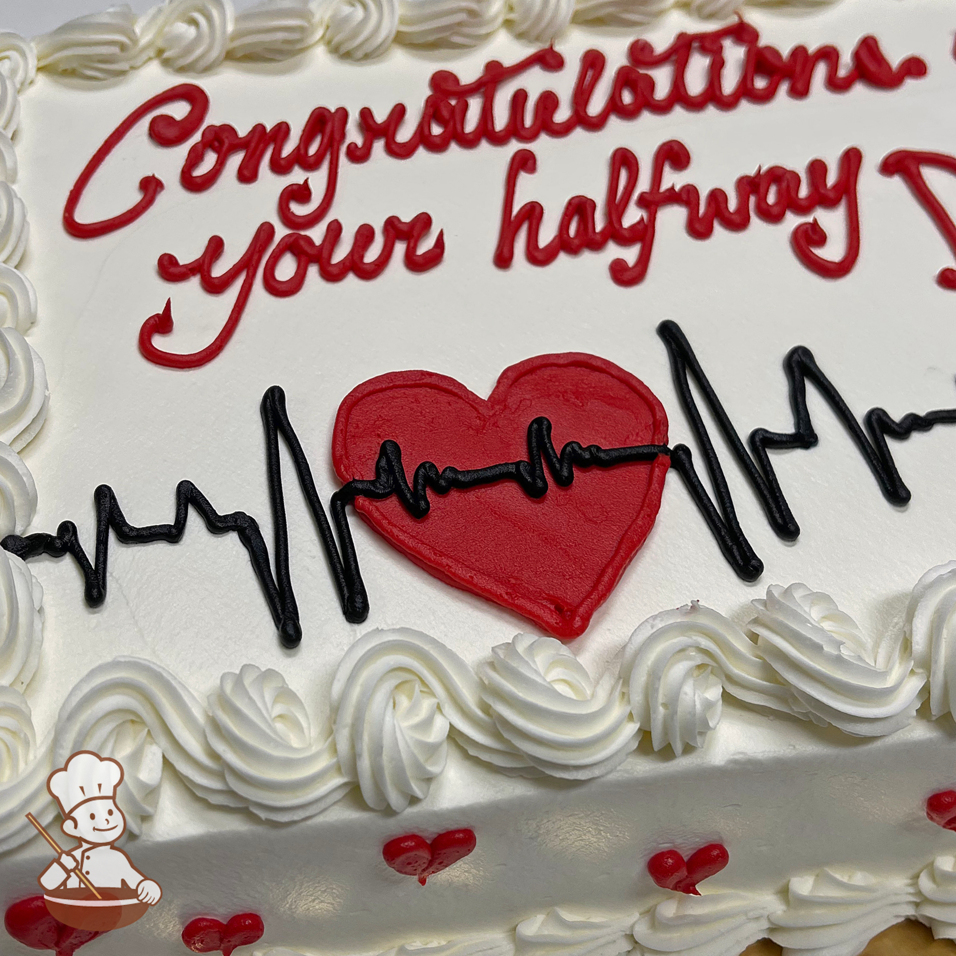 Graduation sheet cake with buttercream heart and EKG heart monitor beats.