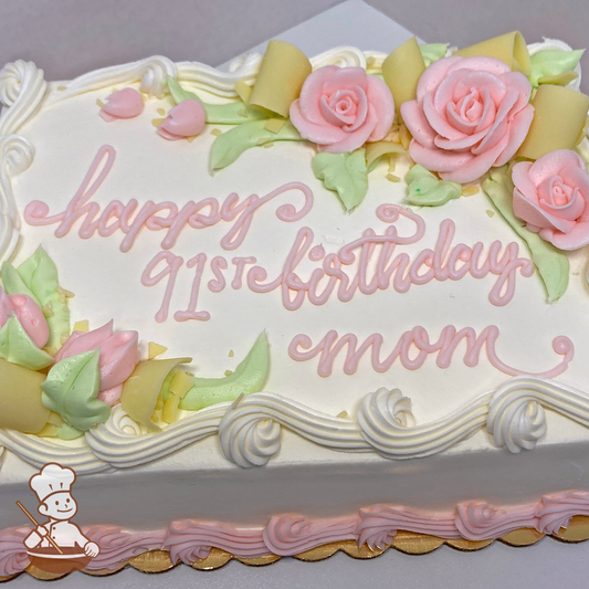 Birthday sheet cake with buttercream roses, rosebuds and white chocolate curls.