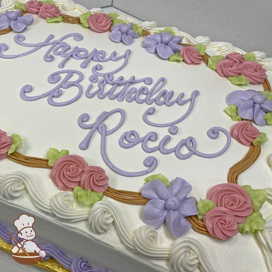 Birthday sheet cake with buttercream rose swirls and hibiscus flowers on wood branch frame.