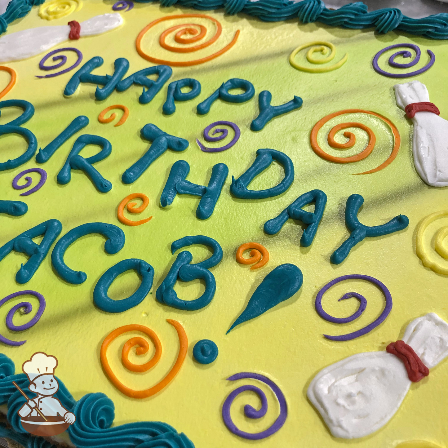 Birthday sheet cake with buttercream bowling pins and scrolls.