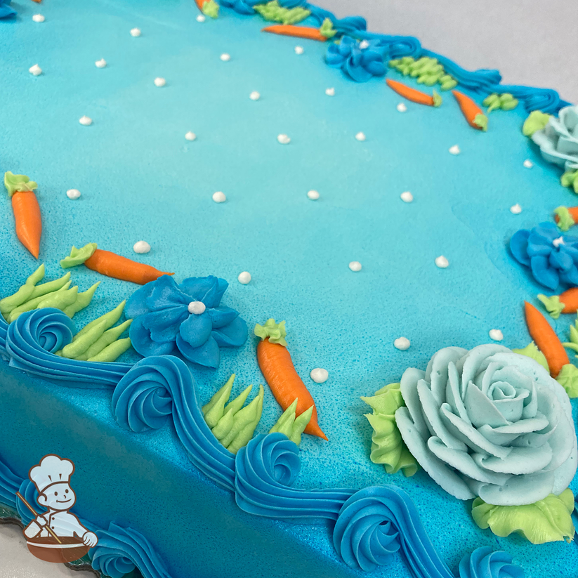 Celebration sheet cake with buttercream roses, flowers, and carrots.