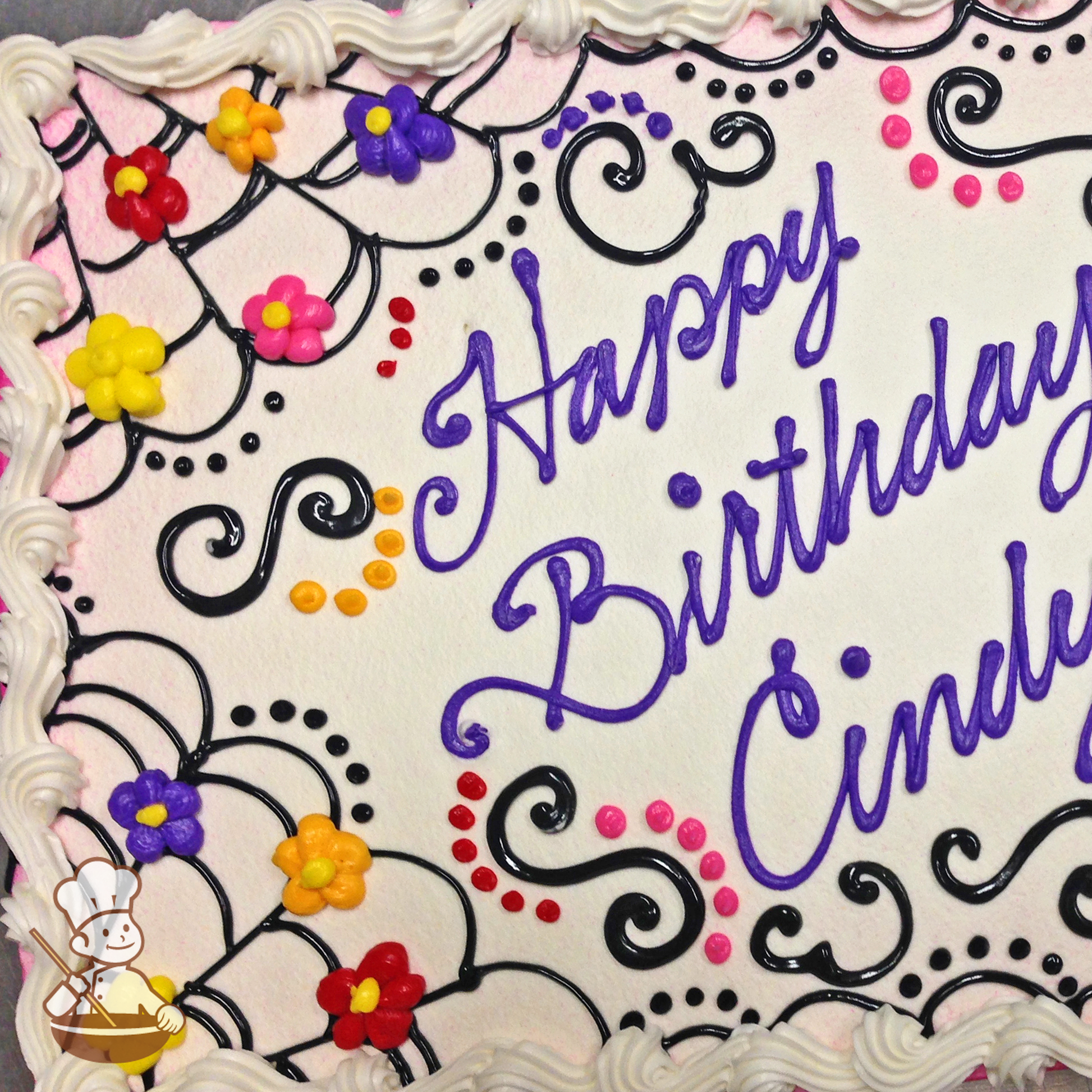 Birthday sheet cake with buttercream piping of spider web and Mexican flower patterns.