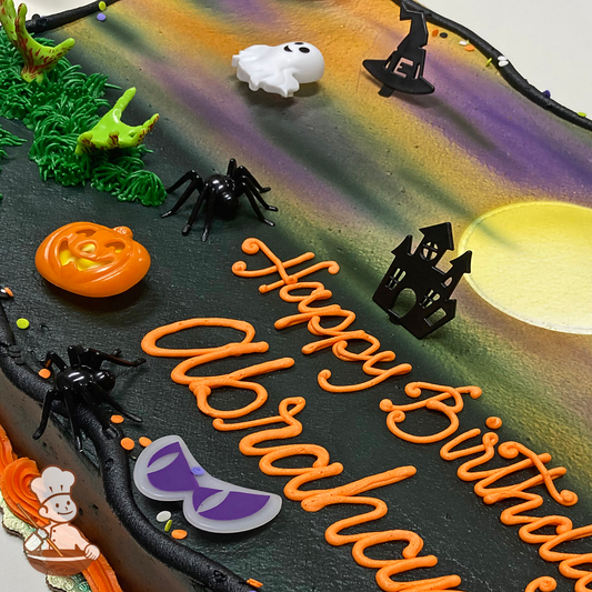 Sheet cake with full moon and dark night sprayed with toys including: hand, hat, ghost, pumpkin, spider, haunted house, eyes.