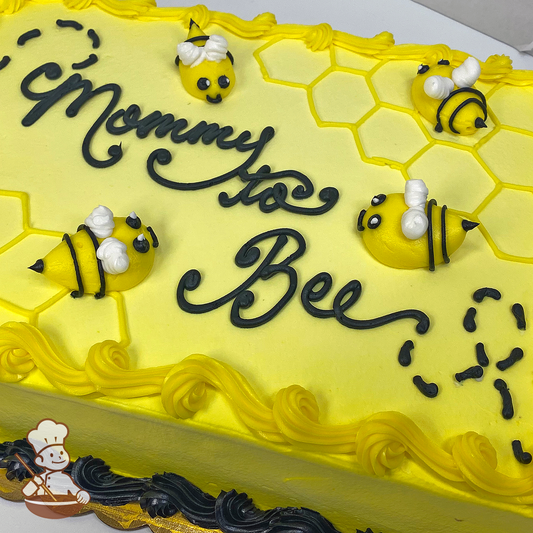 Baby shower cake with honey comb pattern and bumble bees.