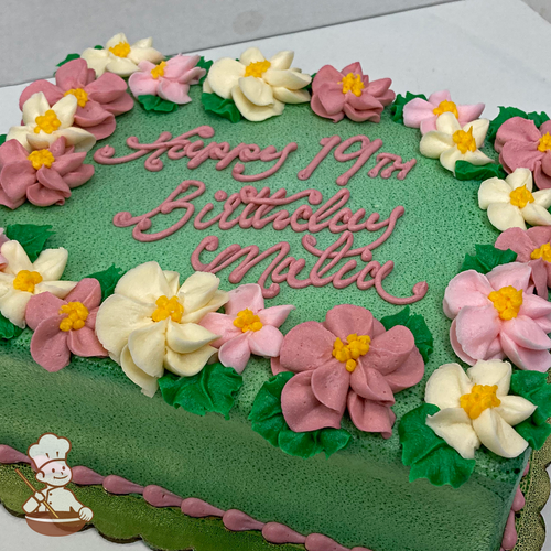 Birthday sheet cake with buttercream appl blossom flowers on the edges of the cake.