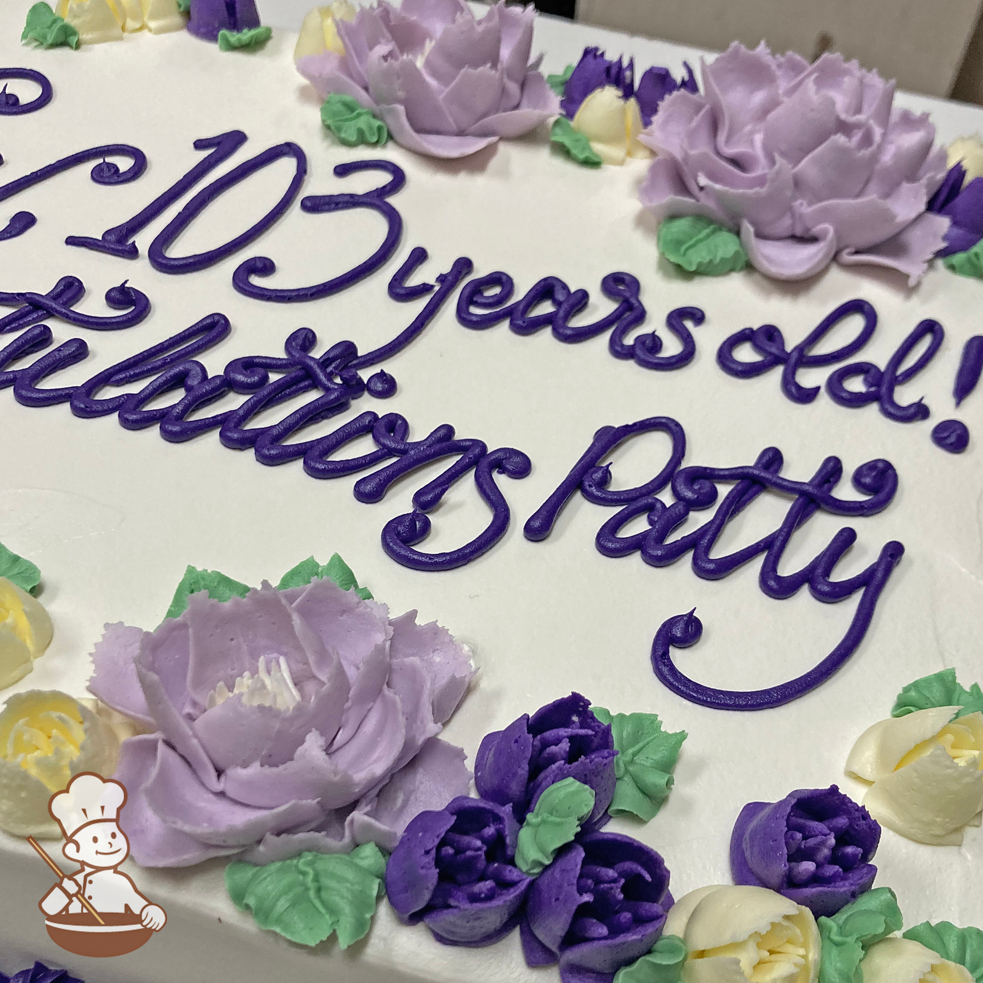 Birthday sheet cake with buttercream peonies and freesia buds.