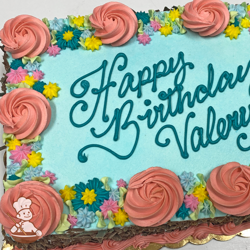 Birthday sheet cake with buttercream swirlette flowers and assorted star borders.