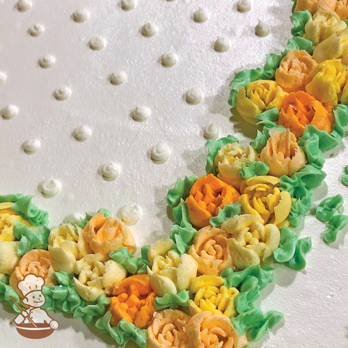 Birthday sheet cake with delicate flower buds along the border edge.