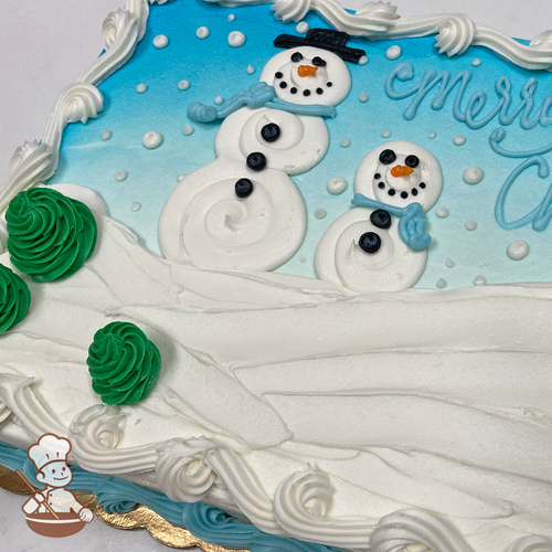 Christmas sheet cake with buttercream snowman wearing top hat and winter scarf, sitting on a snow hill with falling snow.