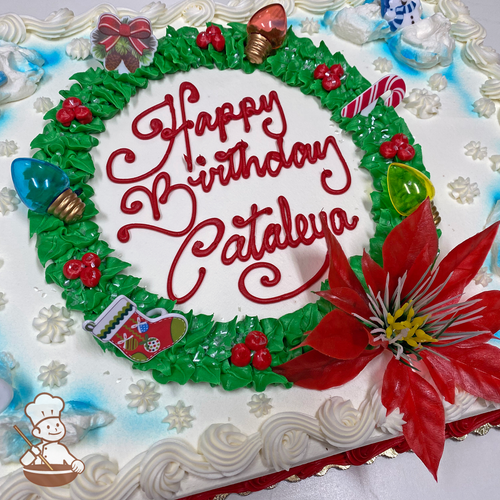 Christmas sheet cake with wreath decorated with berries and holiday lights, with stocking, candy cane and poinsettia toys.