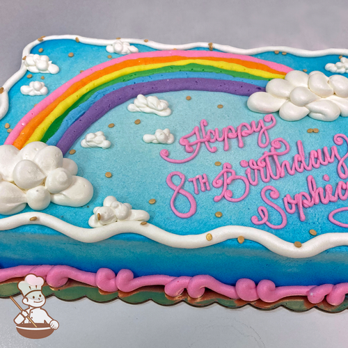 Birthday sheet cake with buttercream rainbow with clouds and sprinkles.