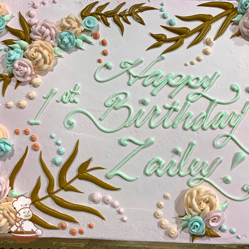 Birthday sheet cake with buttercream roses and whimsical ferns and leaf foliage.