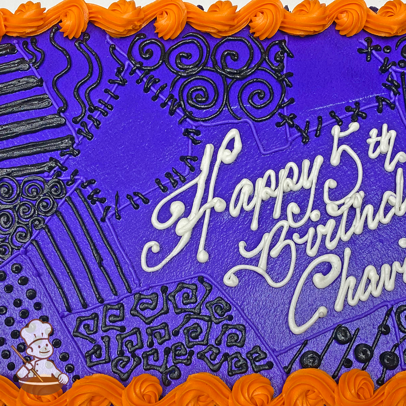 Birthday sheet cake with piped tribal patterns.