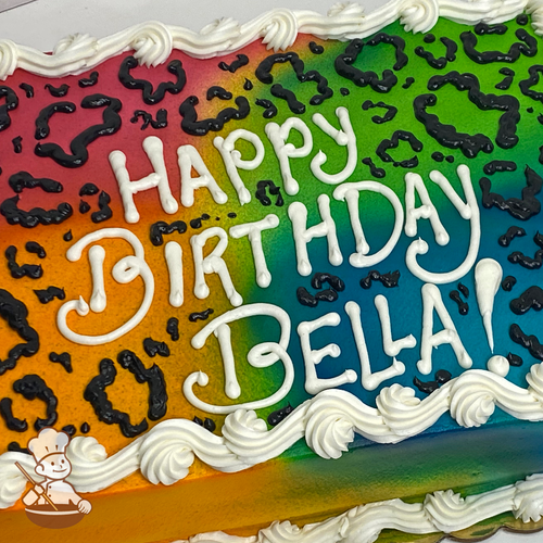 Birthday sheet cake with sprayed colors in each corner and cheetah prints.