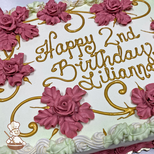Birthday sheet cake with buttercream Hawaiian flowers with writing in gold piping.