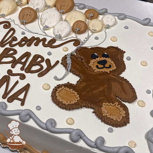 Baby shower sheet cake with buttercream piped teddy bear holding a balloon bouquet and dots.