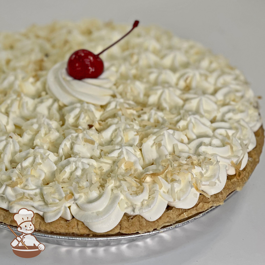 Coconut Cream Pie with whipped cream and toasted coconuts.