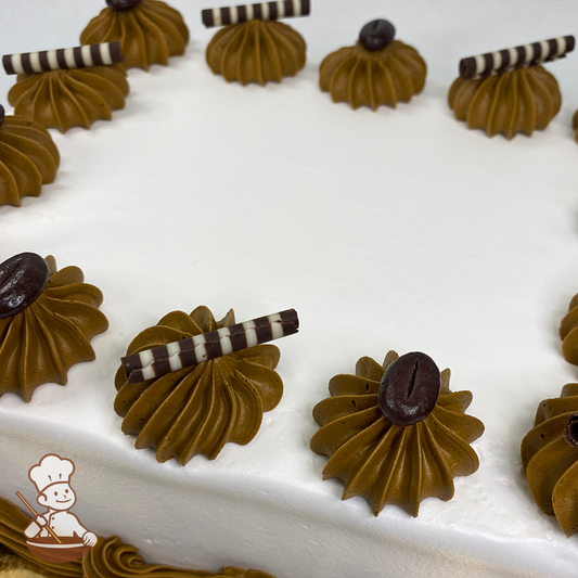 Sheet cake with chocolate swirls topped with espresso beans and chocolate curls.