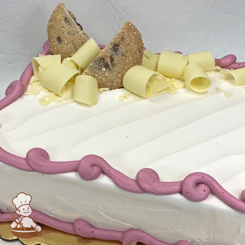 Sheet cake with white chocolate curls and chocolate chip shortbread cookies.