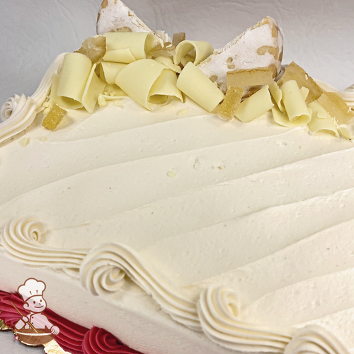 Sheet cake with butter shortbread cookies and white chocolate curls.