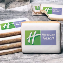 Load image into Gallery viewer, A stack of rectangle butter shortbread cookies with Holiday Inn Resort logo printed directly on a white, lemon sugar icing.