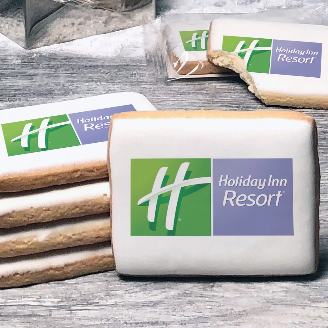A stack of rectangle butter shortbread cookies with Holiday Inn Resort logo printed directly on a white, lemon sugar icing.