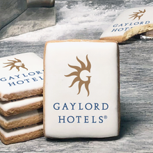 Load image into Gallery viewer, A stack of rectangle butter shortbread cookies with Gaylord Hotels logo printed directly on a white, lemon sugar icing.
