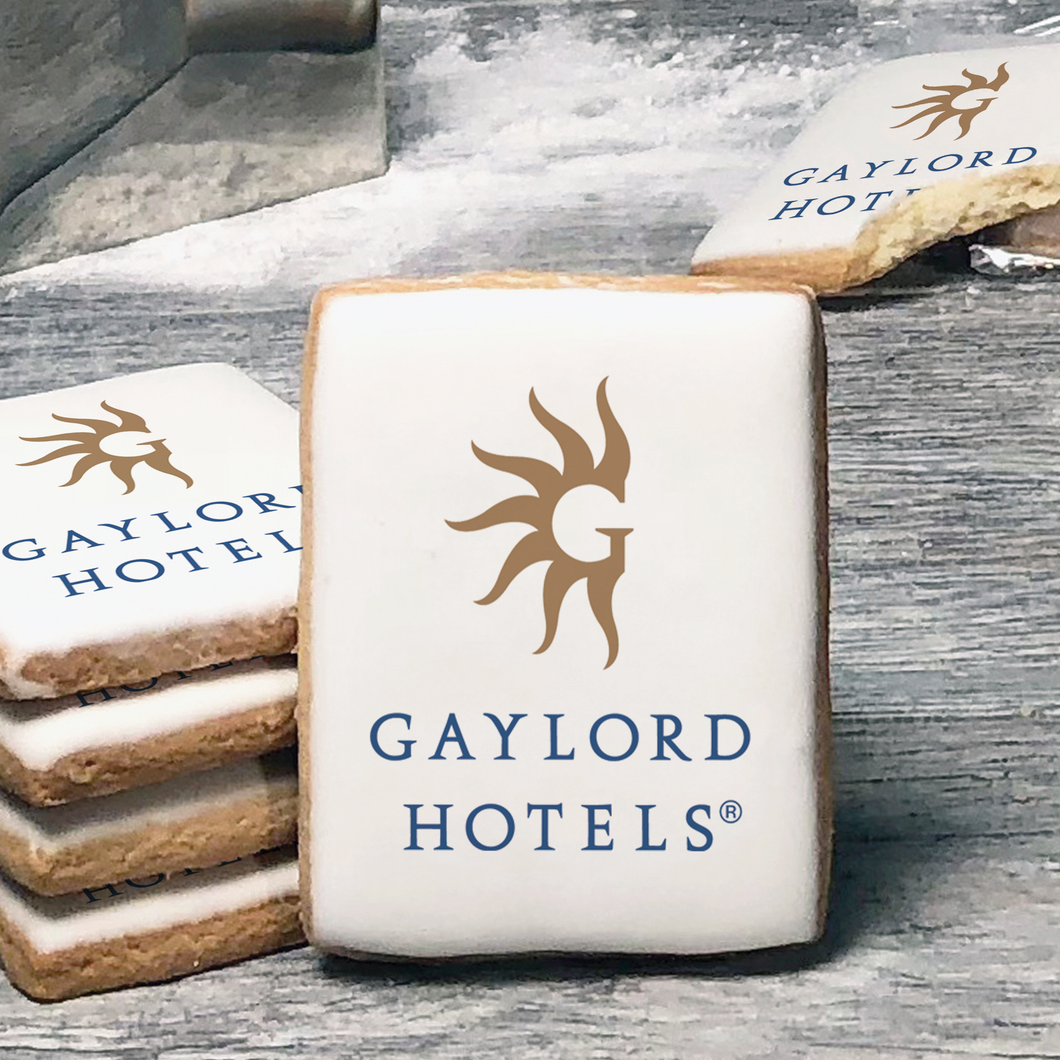 A stack of rectangle butter shortbread cookies with Gaylord Hotels logo printed directly on a white, lemon sugar icing.