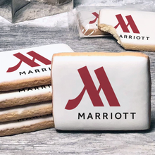 Load image into Gallery viewer, A stack of rectangle butter shortbread cookies with Marriott logo printed directly on a white, lemon sugar icing.
