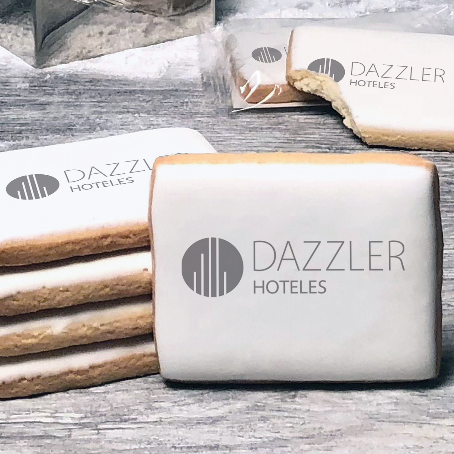 A stack of rectangle butter shortbread cookies with Dazzler logo printed directly on a white, lemon sugar icing.