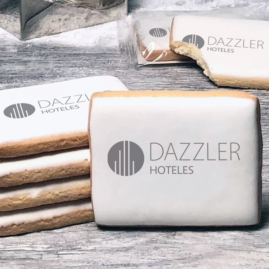 A stack of rectangle butter shortbread cookies with Dazzler logo printed directly on a white, lemon sugar icing.